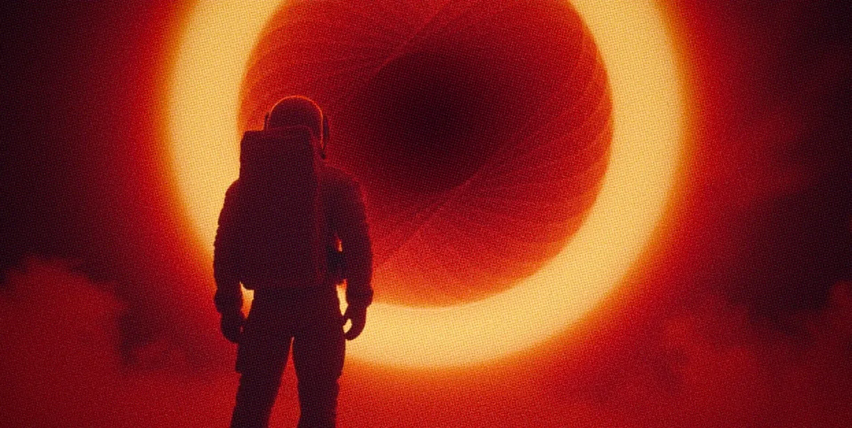 A silhouetted astronaut stands in front of a massive, glowing celestial body, surrounded by a vibrant red and orange atmosphere, evoking a sense of wonder and exploration.
