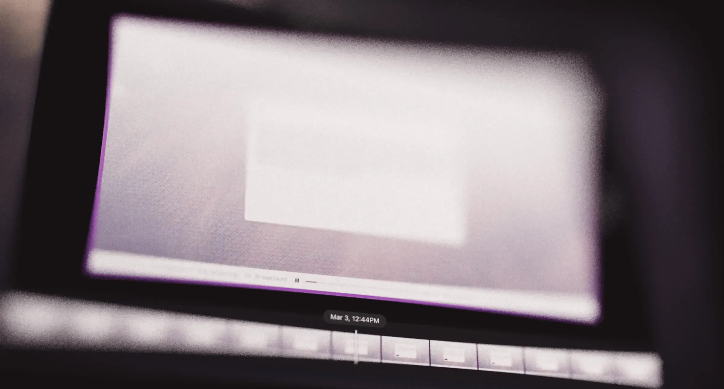 Dark background with two gray triangular rewind icons centered at the top, suggesting a rewind function.